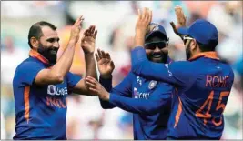  ?? PTI ?? India's Mohammed Shami, left, celebrates with teammates during a macth