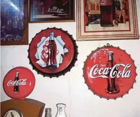  ??  ?? Part of Abd Ghani Abd Rahim’s Coca-Cola memorabili­a.