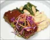  ?? ?? Barbecue meatloaf, pimento macaroni and cheese, beans and greens, Coca-Cola glaze and fresh slaw are part of proposed dishes with an Atlanta flair. Meals are designed to appeal both to locals and those from afar.