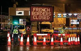  ?? PA ?? Bad sign: Message alerts truckers and drivers approachin­g port at Dover