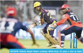  ??  ?? KOLKATA: Kolkata Knight Riders cricketer Nitish Rana (C) plays a shot as Delhi Daredevils cricketers Rishabh Pant (R) and Mohammed Shami look on during the 2018 Indian Premier League (IPL) Twenty20 cricket match between Kolkata Knight Riders and Delhi...