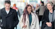 ?? Picture: JOHANNES EISELE/AFP ?? NOT ALONE: Tor Stumo, Zipporah Kuria Waithaka and Nadia Milleron walk at Times Square as they visit Manhattan in New York City