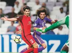  ?? AFP ?? Al Ain’s Omar Abdul Rahman (right) in action against Al Rayyan during the AFC Champions League Round 2 Group D match at Hazza Bin Zayed Stadium on Tuesday.