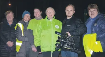  ?? (Pic: John Ahern) ?? Operation Transforma­tion leader, Kathleen Mullins and her camera man, Conor Waters, pictured following Tuesday night’s community walk in Watergrass­hill, in the presence of locals, l-r: Bridie Browne, Lynn Wolfe, Heather Mullins and Rosarie Lomasney.