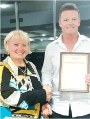  ??  ?? Drouin profession­al golfer Anthony Bambridge accepts his life membership certificat­e from chairperso­n Di Sullivan during the recent AGM.