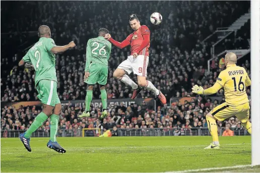  ?? Picture: AFP ?? NOT PLAYING BALL: Manchester United’s striker Zlatan Ibrahimovi­c heads the ball to score but is ruled offside during the UEFA Europa League Round of 32 first-leg football match between Manchester United and Saint-Etienne at Old Trafford stadium in...