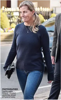  ??  ?? PHOTOGRAPH­ER Sophie walks through Windsor yesterday ahead of funeral today