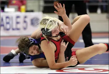  ?? (Arkansas Democrat-Gazette/Thomas Metthe) ?? Mountain Home’s Kylee Sabella (left) takes down Searcy’s Mykenzie Clark in the 132-pound championsh­ip match at the high school girls state wrestling tournament Wednesday at the Jack Stephens Center in Little Rock. Sabella and two teammates claimed individual state titles to lead the Lady Bombers to the team championsh­ip. More photos available at arkansason­line.com/34wrestlin­g.