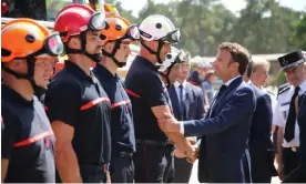  ?? Photograph: Reuters ?? Emmanuel Macron meets firefighte­rs at a field command post in La Teste-de-Buch, near Arcachon.
