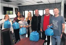  ??  ?? Road runners
Volunteers with their meals on wheels