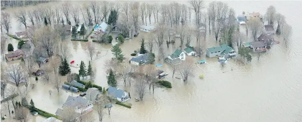  ?? PAUL CHIASSON / THE CANADIAN PRESS ?? Homes in Rigaud, Que., on Monday where flooding hit hard. All told, 1,520 people had been evacuated from their homes in Quebec.