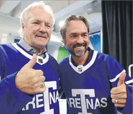  ?? DAVE ABEL ?? Toronto Maple Leafs alumni Darryl Sittler, left, and Darcy Tucker show off the newly unveiled Arenas sweaters Tuesday for the team’s 100th anniversar­y game coming up on Dec. 19. This year’s Leafs lineup will wear the special jerseys that night against...
