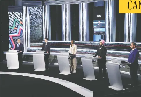  ?? SEAN KILPATRICK / THE CANADIAN PRESS ?? Conservati­ve Leader Erin O'Toole, Liberal Leader Justin Trudeau, Green Leader Annammie Paul, NDP Leader Jagmeet Singh and Bloc Québécois
Leader Yves-François Blanchet stand at their podiums before the French-language leaders debate in Gatineau, Que., on Wednesday.