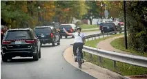  ?? PHOTO: REUTERS ?? Juli Briskman, angered that US President Donald Trump was golfing when other issues needed attention, flipped the bird at his motorcade and lost her job.