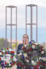  ??  ?? Lynnette Rodriguez, the daughter of New York City firefighte­r Anthony Rodriguez who died in the 9/11 terrorist attacks, addresses attendees at the 9/11 Memorial Service.