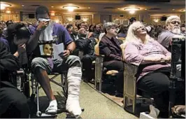  ?? ANDREW SHURTLEFF/THE DAILY PROGRESS ?? Heather Heyer’s mother, Susan Bro, right, and others mourn Wednesday at a memorial in Charlottes­ville, Va., for Heyer, killed Saturday as she opposed a white supremacis­t rally.