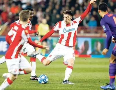  ??  ?? Red Star’s Milan Pavkov (centre) scores his side’s second goal during the Champions League Group C football match against Liverpool at Rajko Mitic stadium in Belgrade yesterday.