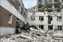  ?? UKRAINIAN EMERGENCY SERVICE VIA AP PHOTO ?? Rescuers work at the site of a Russian missile strike in Chernihiv, Ukraine, Wednesday.