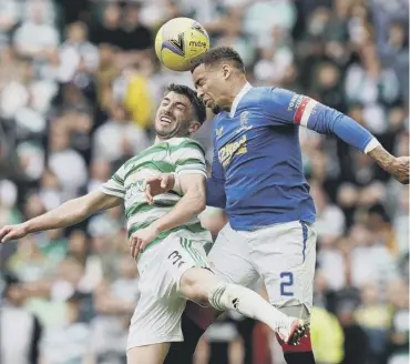  ?? ?? 0 Celtic’s Greg Taylor battles for the ball with Rangers captain James Tavernier