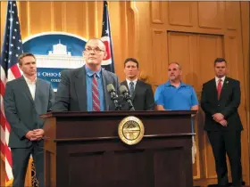  ?? KANTELE FRANKO — THE ASSOCIATED PRESS FILE ?? Roger Beedon discusses how sexual misconduct by now-deceased Ohio State team doctor Richard Strauss has affected his life, during a news conference with fellow Strauss accusers, from left, Brian Garrett, Dan Ritchie and Mike Flusche, and state Rep. Brett Hillyer, at the Statehouse in Columbus, Ohio. Men who say they were sexually abused by longtime Ohio State team doctor Richard Strauss are recounting how it changed their lives to make their case that the university owes them financial compensati­on.