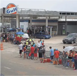  ?? JOE RAEDLE, GETTY IMAGES ?? Gasoline remains in short supply, though hundreds of stations are now open.