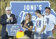  ?? AP ?? Donald Trump shares the stage with Sarah Root’s family at the Iowa fairground­s on Saturday. She was killed after her car was hit by another. The driver was reportedly a Honduran immigrant in the country illegally.