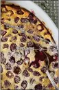  ?? PHOTO BY CATHY THOMAS ?? Raspberry clafouti is a French dessert of fruit covered in a thick, flanlike batter.