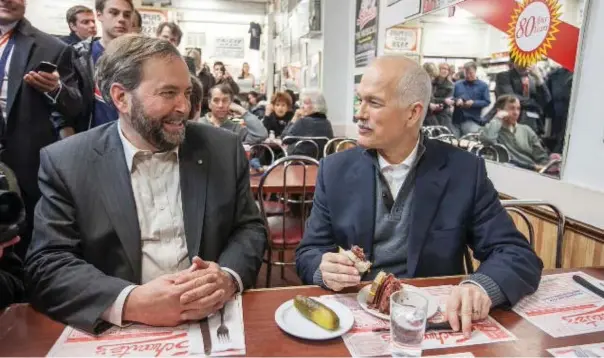  ?? JENNA MARIE WAKANI ?? Mulcair and Jack Layton at Schwartz’s deli in Montreal during the 2011 federal election campaign, which led to a shocking tally of 59 Quebec seats for the party.
