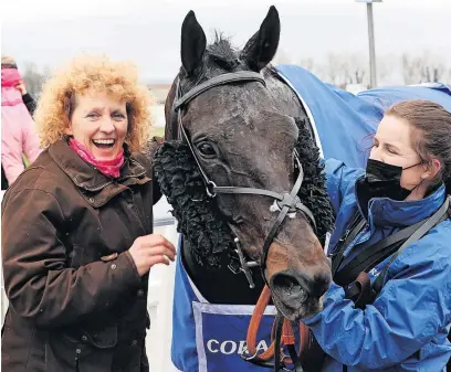  ?? ?? Sad loss Trainer Lucinda Russell (left) celebrates with Mighty Thunder after the horse’s win in the Coral Scottish Grand National of 2021. Photo by Jeff Holmes-pool/getty Images