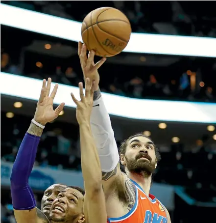  ?? GETTY IMAGES ?? Kiwi and Thunder centre Steven Adams grabs a rebound against the Charlotte Hornets yesterday.