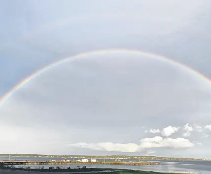  ??  ?? Judith Brennan was rewarded for looking up! She spotted this magnificen­t evening rainbow over Indian Beach, North Sydney, N.S.