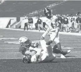  ?? STEVEN MUSCO/COURTESY ?? Yale’s JJ Howland tumbles across the goal line after a 74-yard touchdown catch against Holy Cross on Saturday in New Haven.