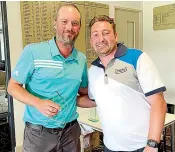  ?? ?? Ryan Hammond (left) had to produce his best form - a seven under par round and a birdie on the first play-off hole - to win his 11th Drouin Golf Club championsh­ip. Club captain Glenn Robinson congratula­ted Hammond.