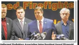  ??  ?? Uniformed Firefighte­rs Associatio­n Union President Gerard Fitzgerald (center) urges more federal funds to aid ailing WTC survivors.