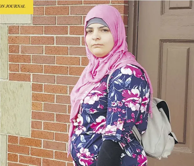  ?? DON MACPHERSON AND CAITLIN DUTT / THE DAILY GLEANER ?? Bayan Ayoub leaves the courthouse in Burton, N.B., on Tuesday. Ayoub’s parents, Ahmad and Faten Ayoub, were freed from jail this week after pleading guilty to threatenin­g the 25-year-old woman with an honour killing. The couple, Syrian refugees, will be on probation for a year.