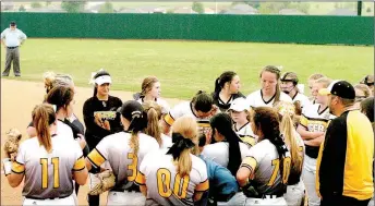  ?? MARK HUMPHREY ENTERPRISE-LEADER ?? Prairie Grove coach Dustin Beck talks to the Lady Tigers softball team between innings. Prairie Grove defeated Berryville, 14-4, on Thursday to qualify for the 4A North Regional tournament this week at Dover.