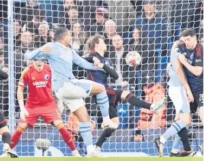  ?? — Gambar AFP ?? PEMBUKA TIRAI: Akanji (tengah) menjaringk­an gol pada perlawanan Liga Juara-Juara pusingan kedua di antara Manchester City dan Copenhagen di Stadium Etihad, di Manchester, England, kelmarin.