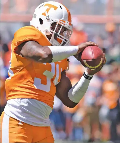  ?? STAFF FILE PHOTO BY ROBIN RUDD ?? Tennessee linebacker Darrin Kirkland Jr. goes through drills before the spring game. Kirkland’s limitation­s during preseason practices because of his right knee have raised questions about how much depth the Vols will have at inside linebacker early this season.