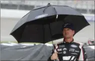  ?? CARLOS OSORIO - THE ASSOCIATED PRESS ?? Clint Bowyer stands on pit row waiting out the rain delay during the NASCAR cup series auto race at Michigan Internatio­nal Speedway, Sunday, June 9, 2019, in Brooklyn, Mich.