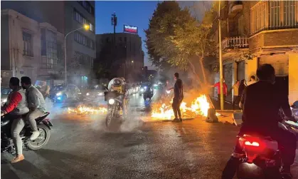  ?? Photograph: AFP/Getty Images ?? Fires in the streets of Tehran on Saturday. The protests across the country are now in their fourth week.