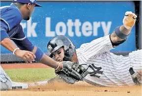  ?? AP ?? OUT! Gleyber Torres was caught trying to advance to third after his double scored Didi Gregorius in the seventh inning of the first game of a doublehead­er against the Royals on Saturday.