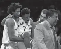  ?? ADAM HUNGER, THE ASSOCIATED PRESS ?? Toronto Raptors guard Kyle Lowry (7) reacts as he is carried off by teammates late in the game against the Nets in Brooklyn on Monday.