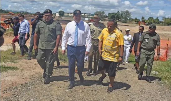  ??  ?? Australian Prime Minister, Scott Morrison (middle front row), with Minister for Defence, National Security and Foreign Affairs, Inia Seruiratu (in yellow shirt), and their delegation­s during the tour of Blackrock Peacekeepi­ng and Humanitari­an Assistance Camp in Nadi on October 12, 2019.