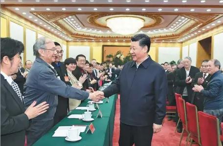  ?? XIE HUANCHI / XINHUA ?? President Xi Jinping chairs a symposium in Beijing for teachers of ideologica­l and political theory and greets attendees on Monday.