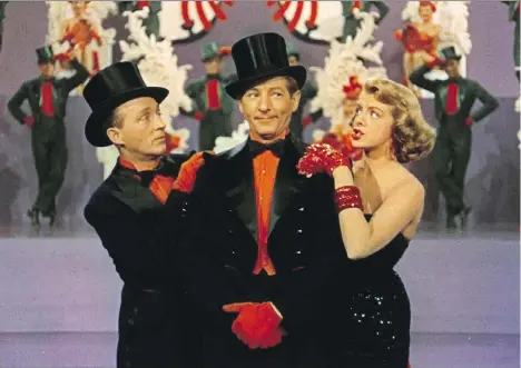  ??  ?? Bing Crosby, left, Danny Kaye and Rosemary Clooney star in the clunker White Christmas, released by Paramount Pictures in 1954.