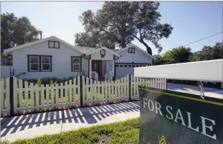  ?? JOHN RAOUX — THE ASSOCIATED PRESS FILE ?? A home for sale in Orlando, Fla. The National Associatio­n of Realtors said Tuesday that existing home sales fell 3.4% last month from April to a seasonally adjusted annual rate of 5.41million.