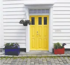  ??  ?? Cheery, optimistic and inviting, a yellow door is an instant mood-elevator.