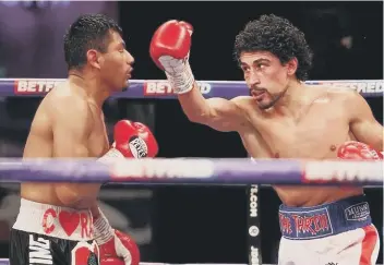  ??  ?? Jordan Gill (right) on his way to beating Cesar Juarez. Photo: Mark Robinson Matchroom Boxing.