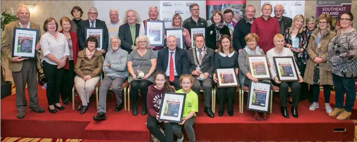  ??  ?? Wexford Tidy Towns representa­tives with Minister Michael Ring at the SuperValu TidyTowns 2018 South East Regional Awards at the Springhill Court Hotel, Kilkenny.