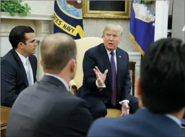  ?? EVAN VUCCI — THE ASSOCIATED PRESS ?? President Donald Trump speaks during a meeting with Governor Ricardo Rossello of Puerto Rico in the Oval Office of the White House.